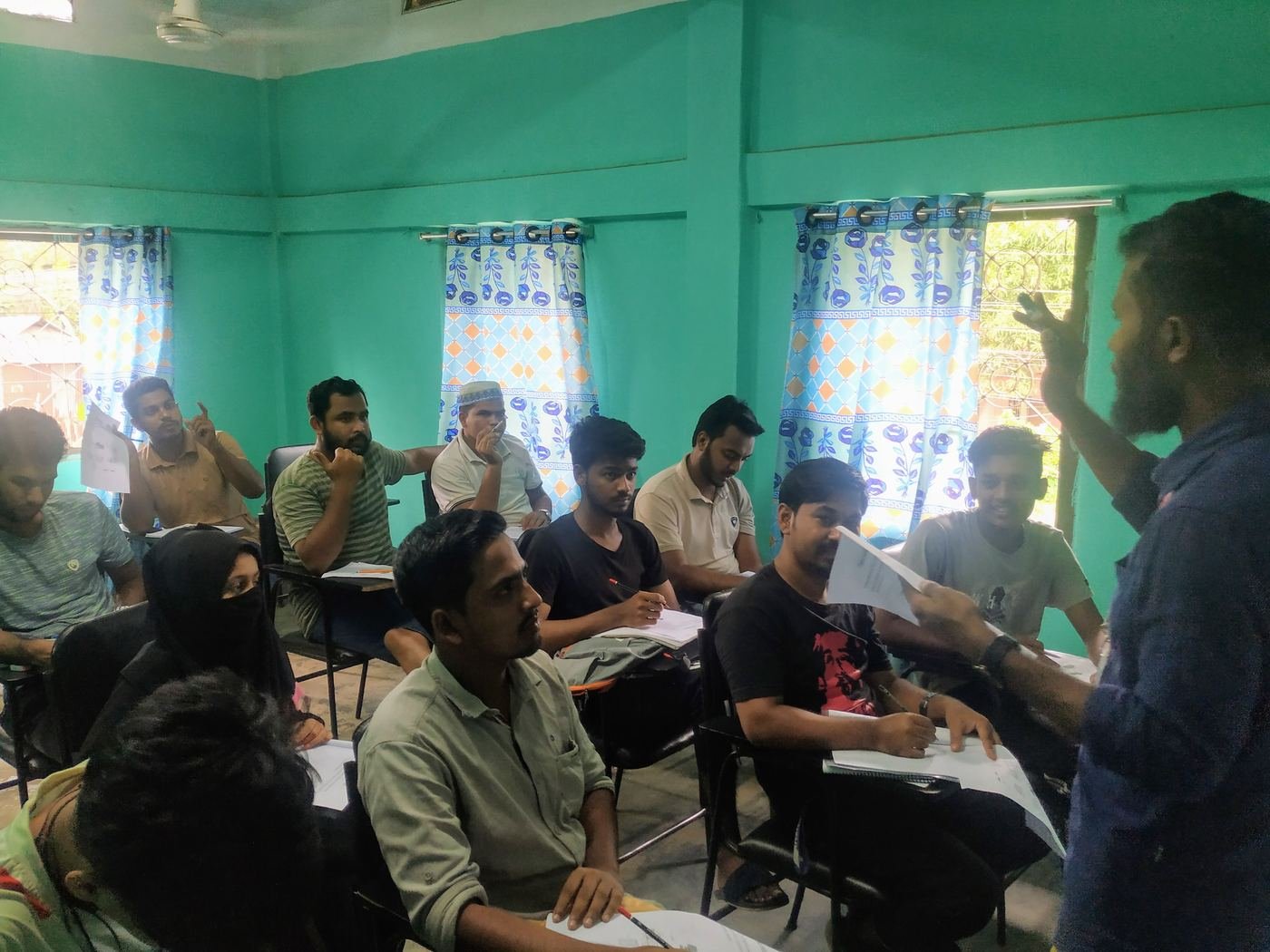 Students of the first Praxis batch working through an IELTS lesson